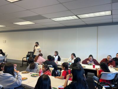 Residents gather around tables during an idea collection session